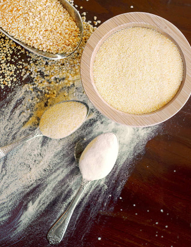 Various textures of garlic, from fine powder to minced bits, displayed in bowls and on spoons